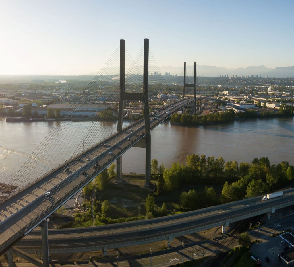 Aerial view of Alex Fraser Bridge during a vibrant sunny day